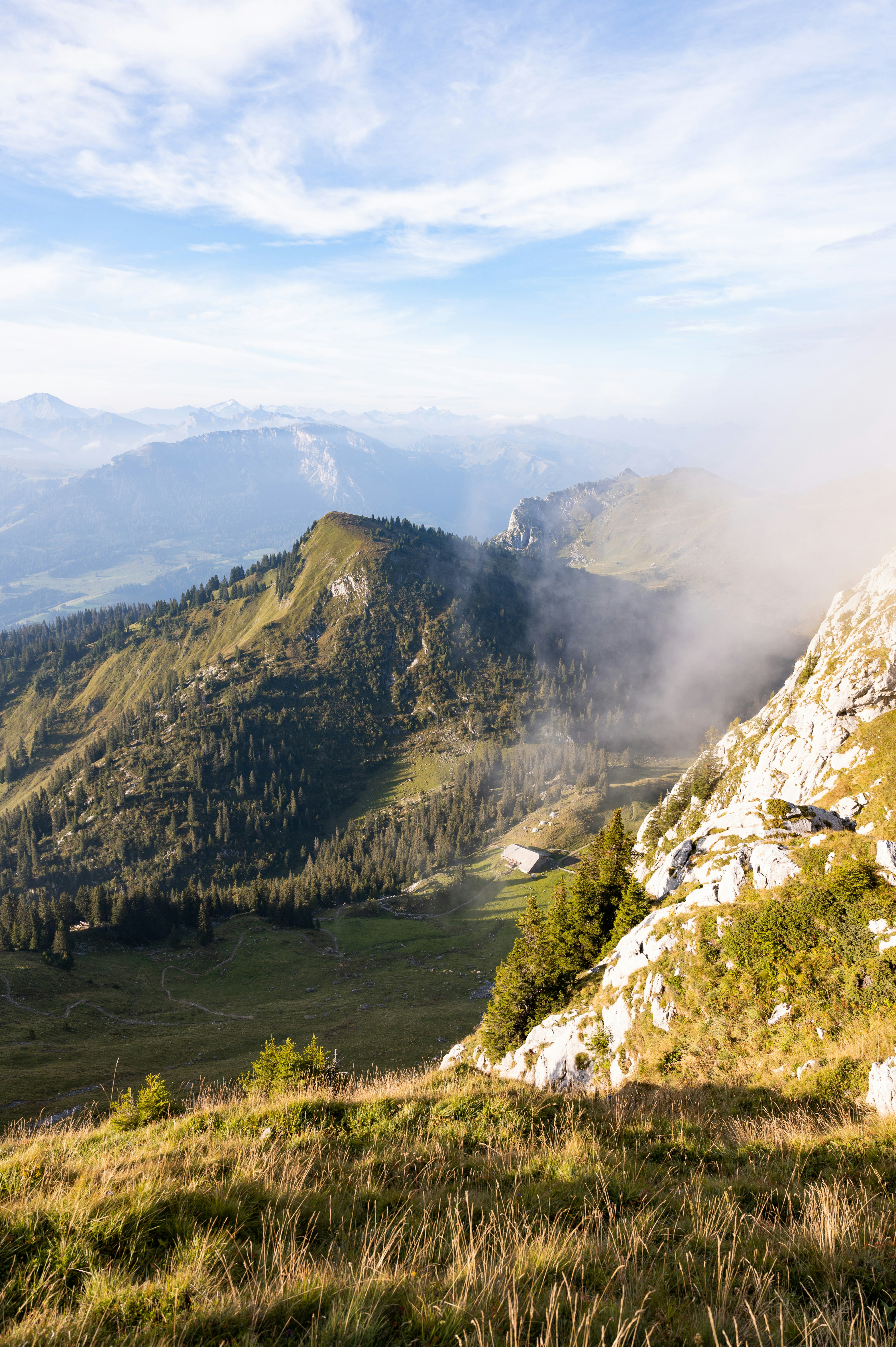 green and brown mountains under white clouds during daytime